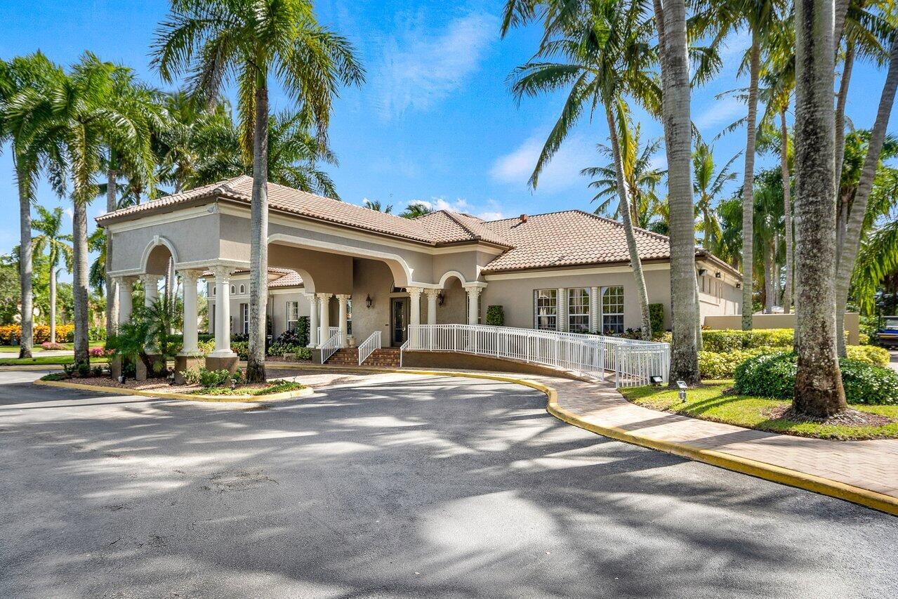8398 Vía Serena Boca Raton, FL 33433 - Photo 35 of 50 a front view of a house with garden
