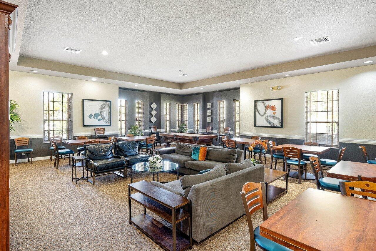 8398 Vía Serena Boca Raton, FL 33433 - Photo 40 of 50 a living room with furniture and a large window