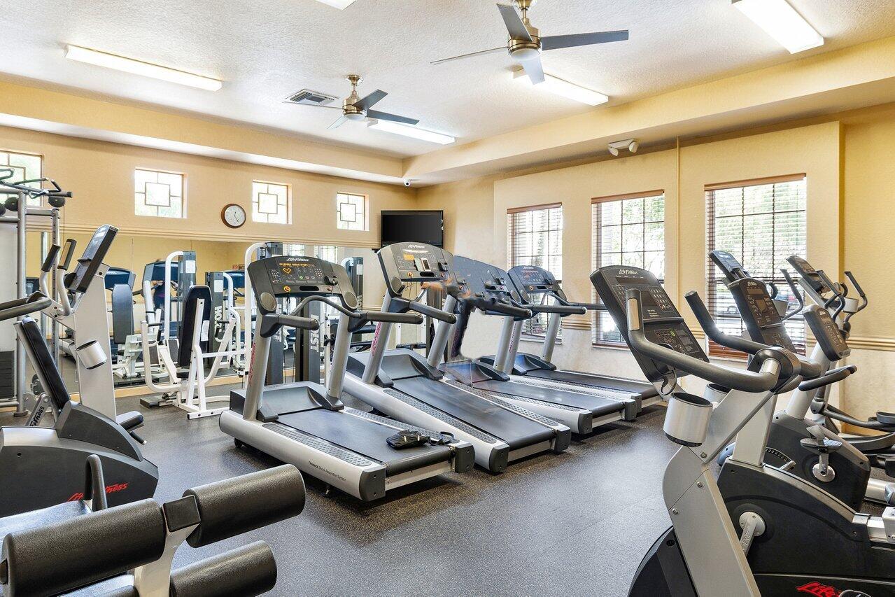 8398 Vía Serena Boca Raton, FL 33433 - Photo 42 of 50 a view of a room with gym equipment