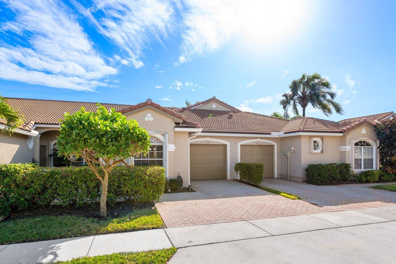 8398 Vía Serena Boca Raton, FL 33433 - Photo 49 of 50 front view of a house with a yard