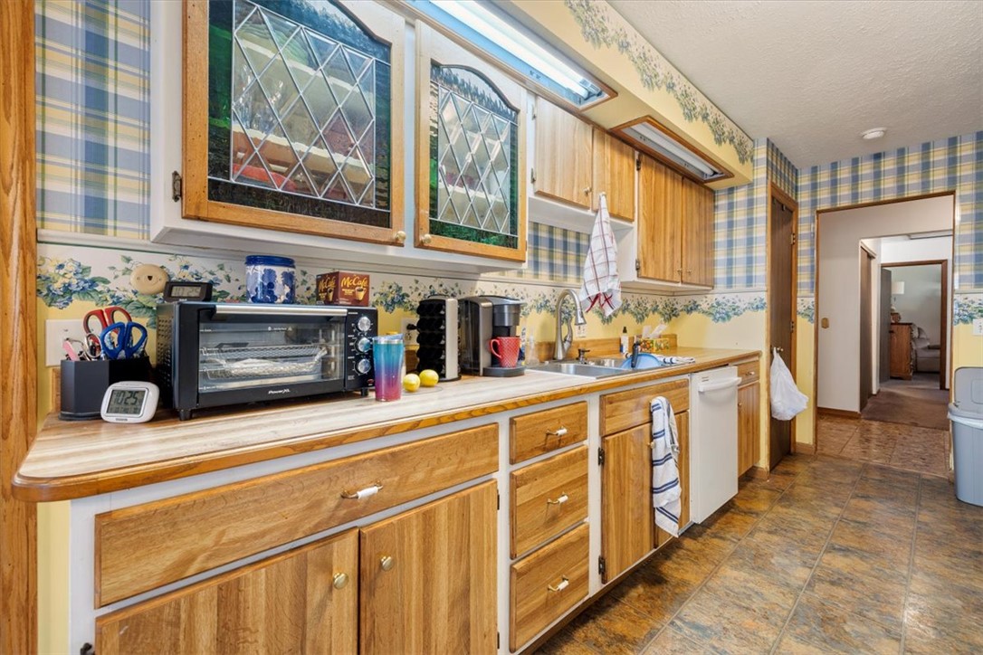 7225 Garber Road Clayton, OH 45415 - Photo 25 of 33 This bright kitchen features ample cabinetry and practical counter space, perfect for everyday living.