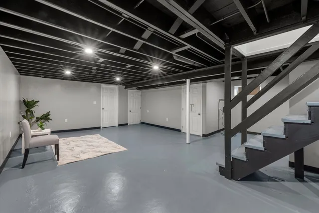 a view of an empty room with stairs