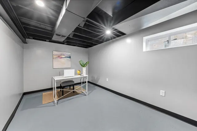 a view of workspace with wooden floor