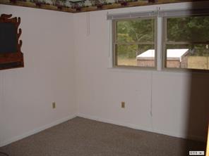 8504 A Smith Road Stanfield, NC 28163 - Photo 5 of 6 an empty room with a window