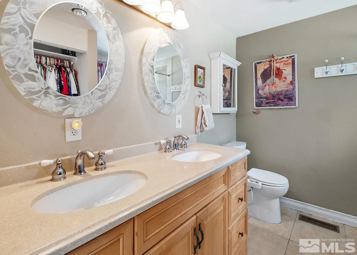 4155 Garlan Lane Reno, NV 89509 - Photo 15 of 24 a bathroom with a sink and a mirror