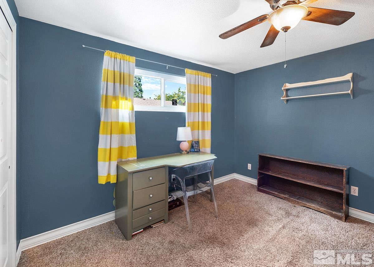 4155 Garlan Lane Reno, NV 89509 - Photo 18 of 24 a view of a workspace with furniture and a window