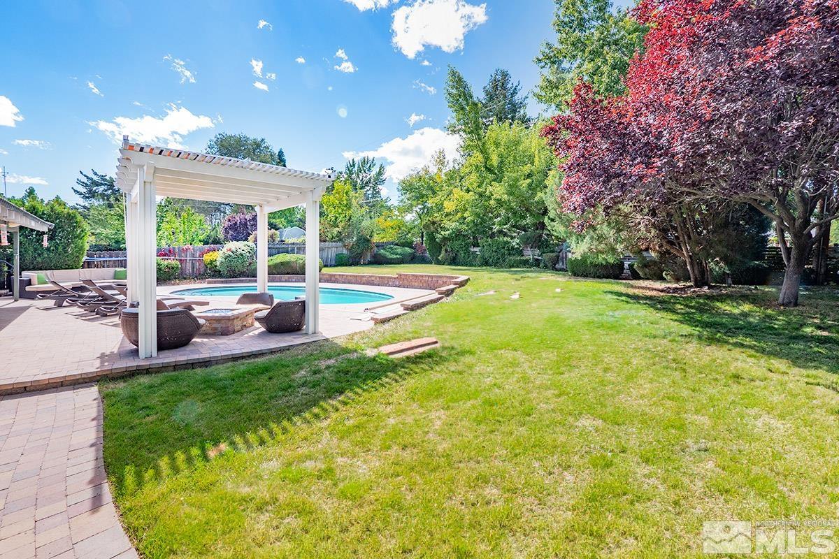 4155 Garlan Lane Reno, NV 89509 - Photo 21 of 24 a view of a house with a backyard porch and sitting area