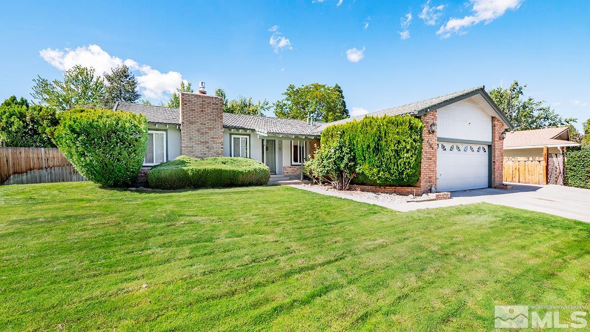 4155 Garlan Lane Reno, NV 89509 - Photo 23 of 24 a front view of a house with a garden