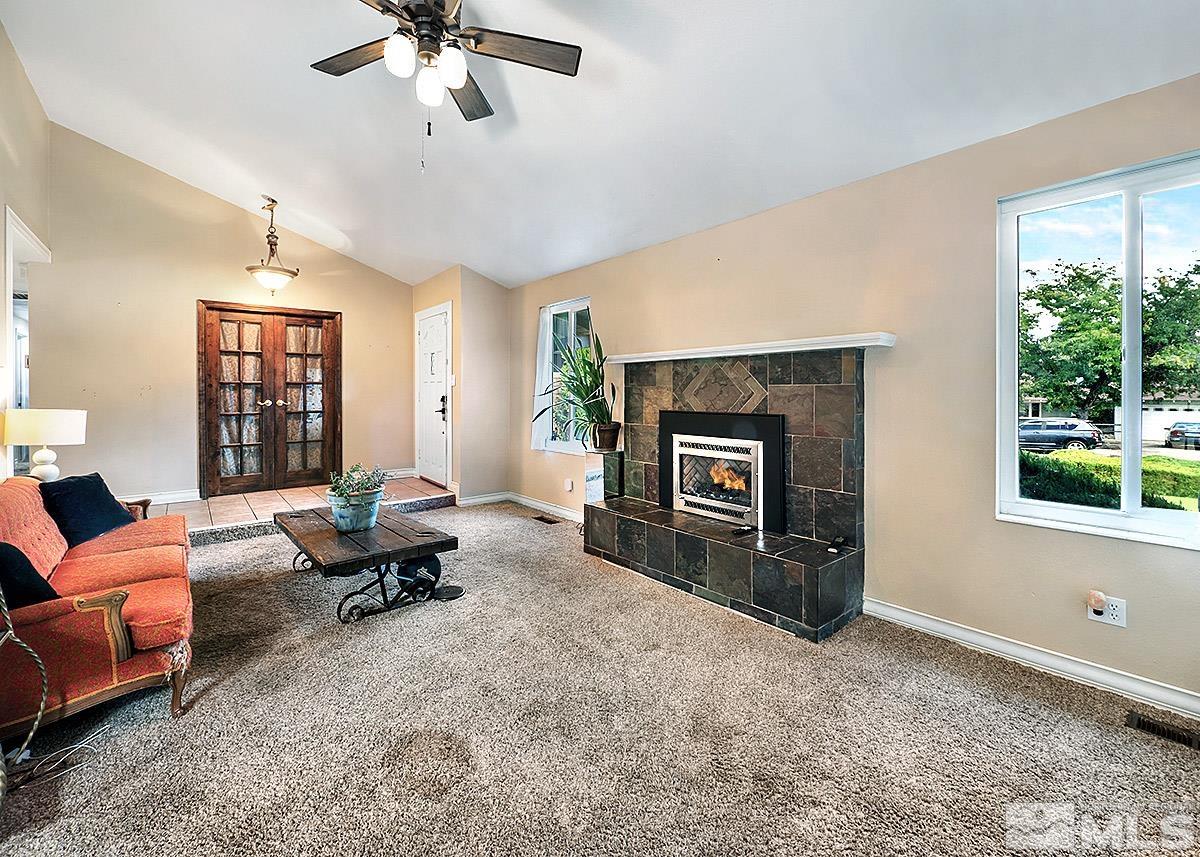 4155 Garlan Lane Reno, NV 89509 - Photo 8 of 24 a living room with furniture and a fireplace