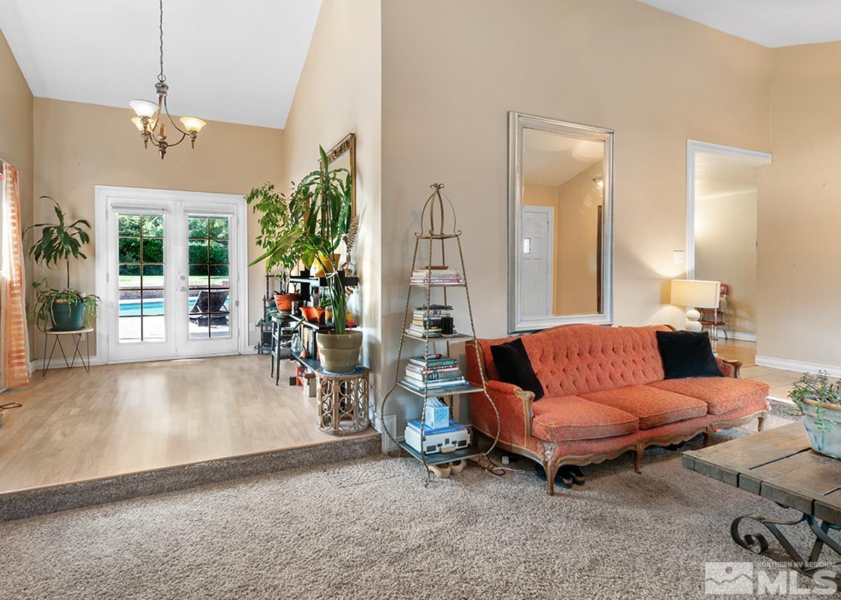 4155 Garlan Lane Reno, NV 89509 - Photo 9 of 24 a living room with furniture and a chandelier