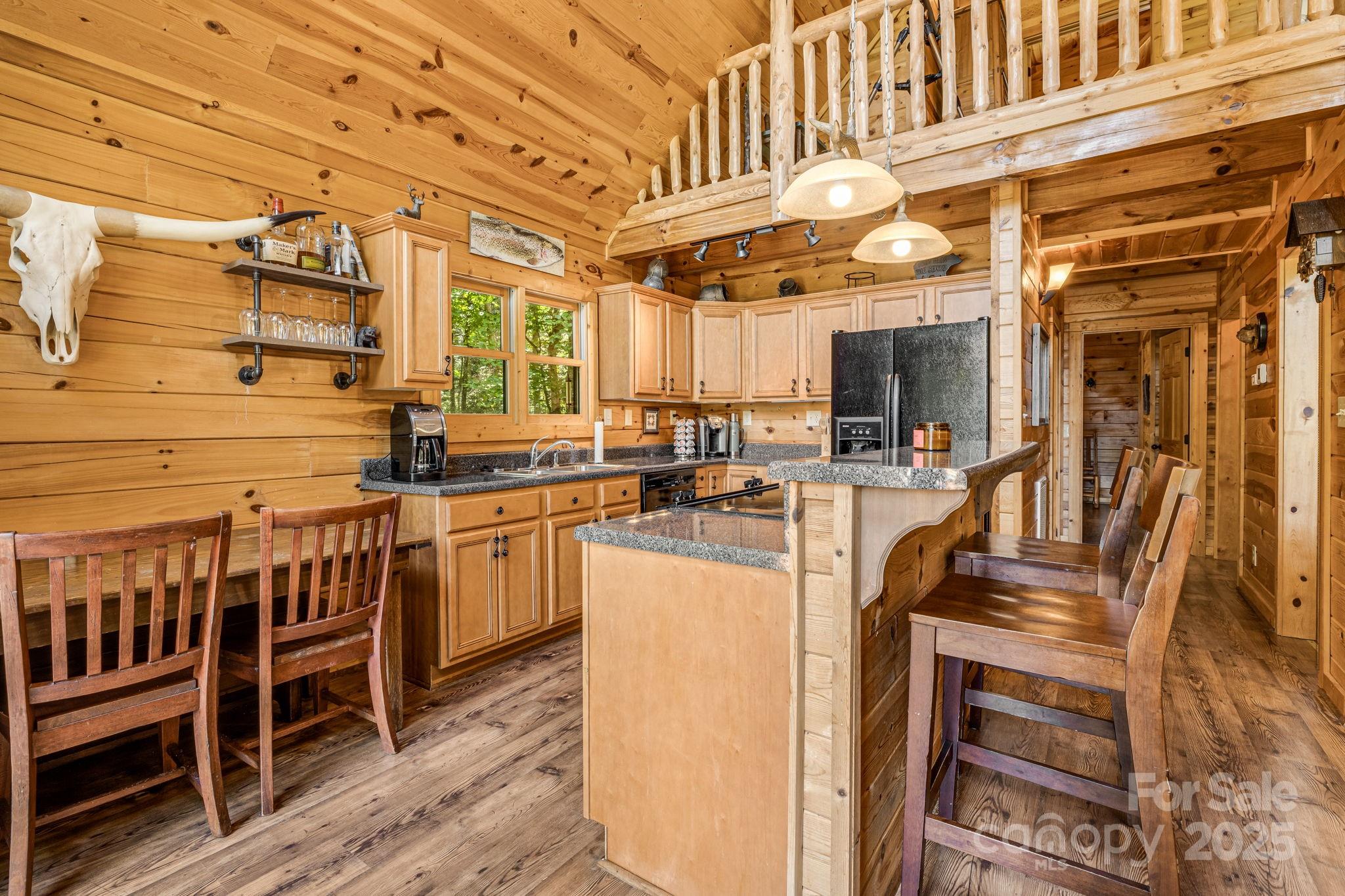 3617 Lonesome Mountain Road Marshall, NC 28753 - Photo 17 of 46 a kitchen with counter top space and appliances
