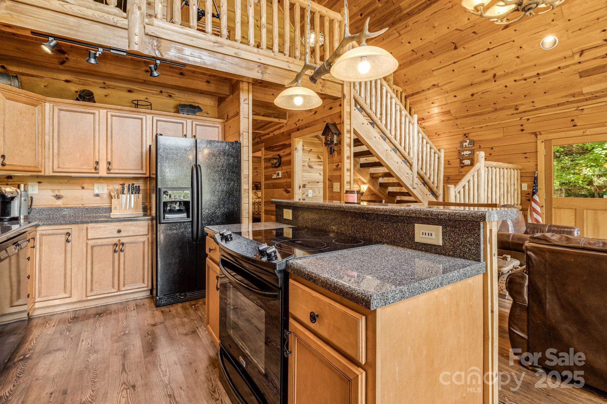 3617 Lonesome Mountain Road Marshall, NC 28753 - Photo 18 of 46 a kitchen that has a cabinets and a stove
