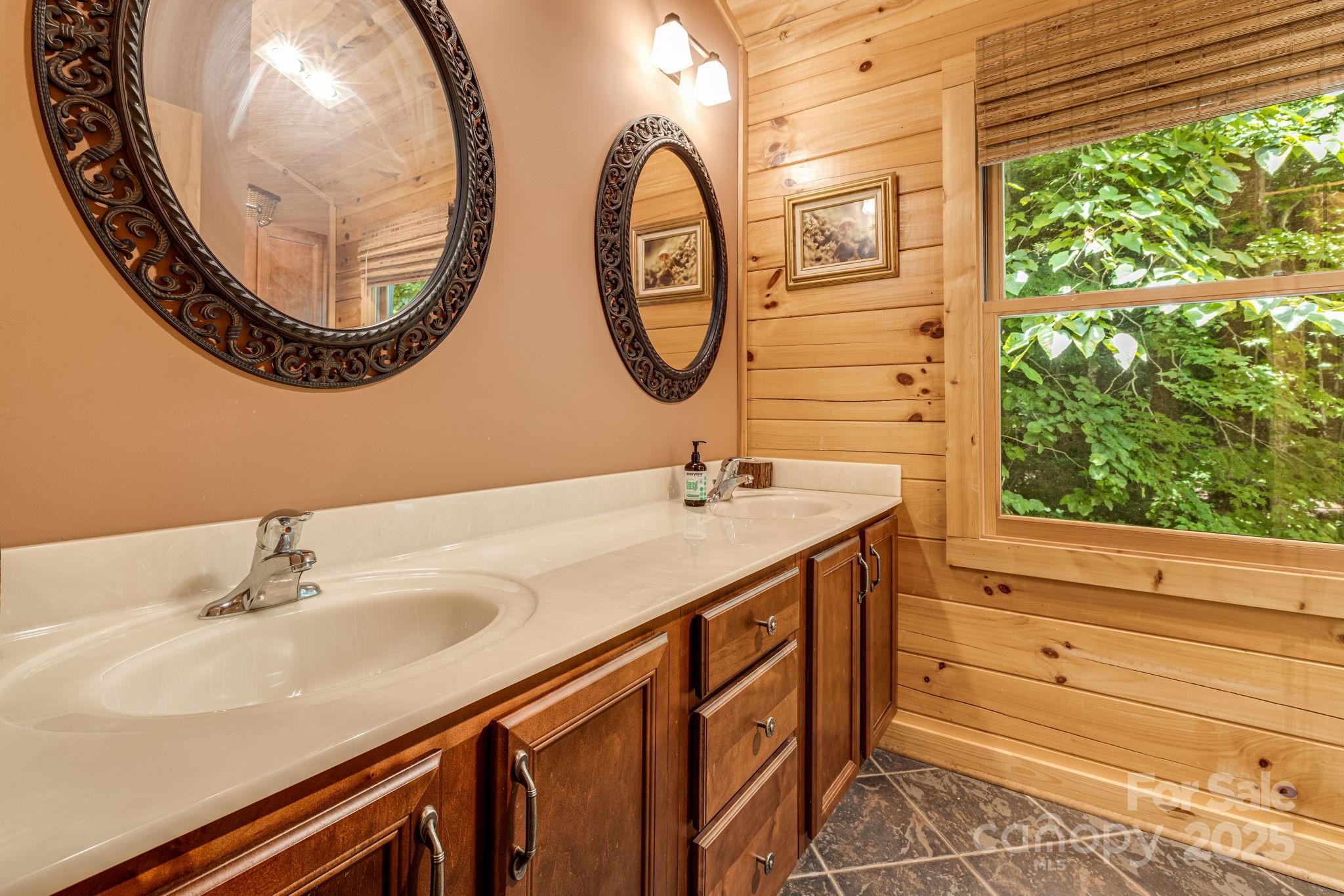 3617 Lonesome Mountain Road Marshall, NC 28753 - Photo 24 of 46 a bathroom with a sink and a mirror