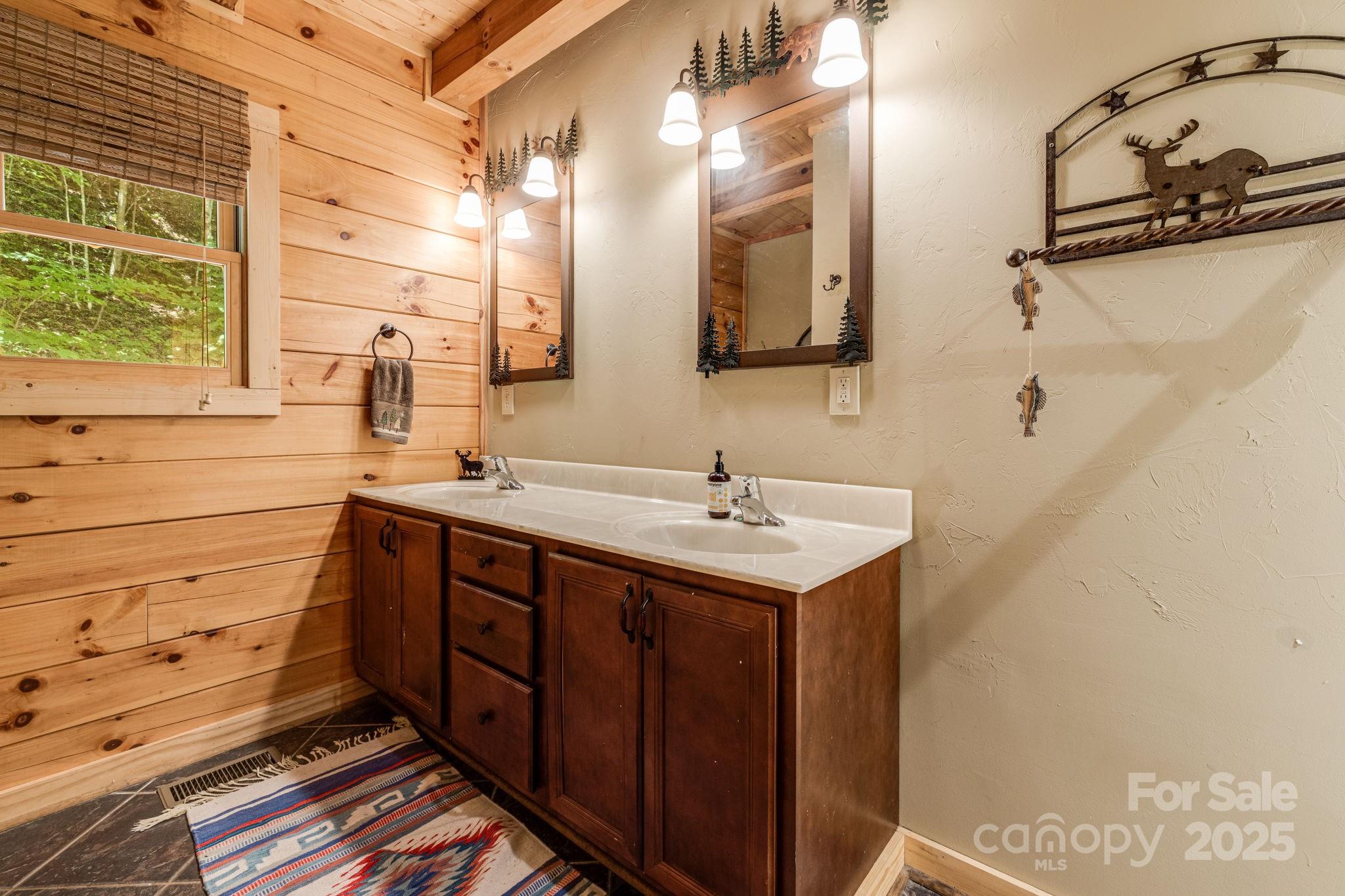 3617 Lonesome Mountain Road Marshall, NC 28753 - Photo 29 of 46 a bathroom with a sink and a mirror