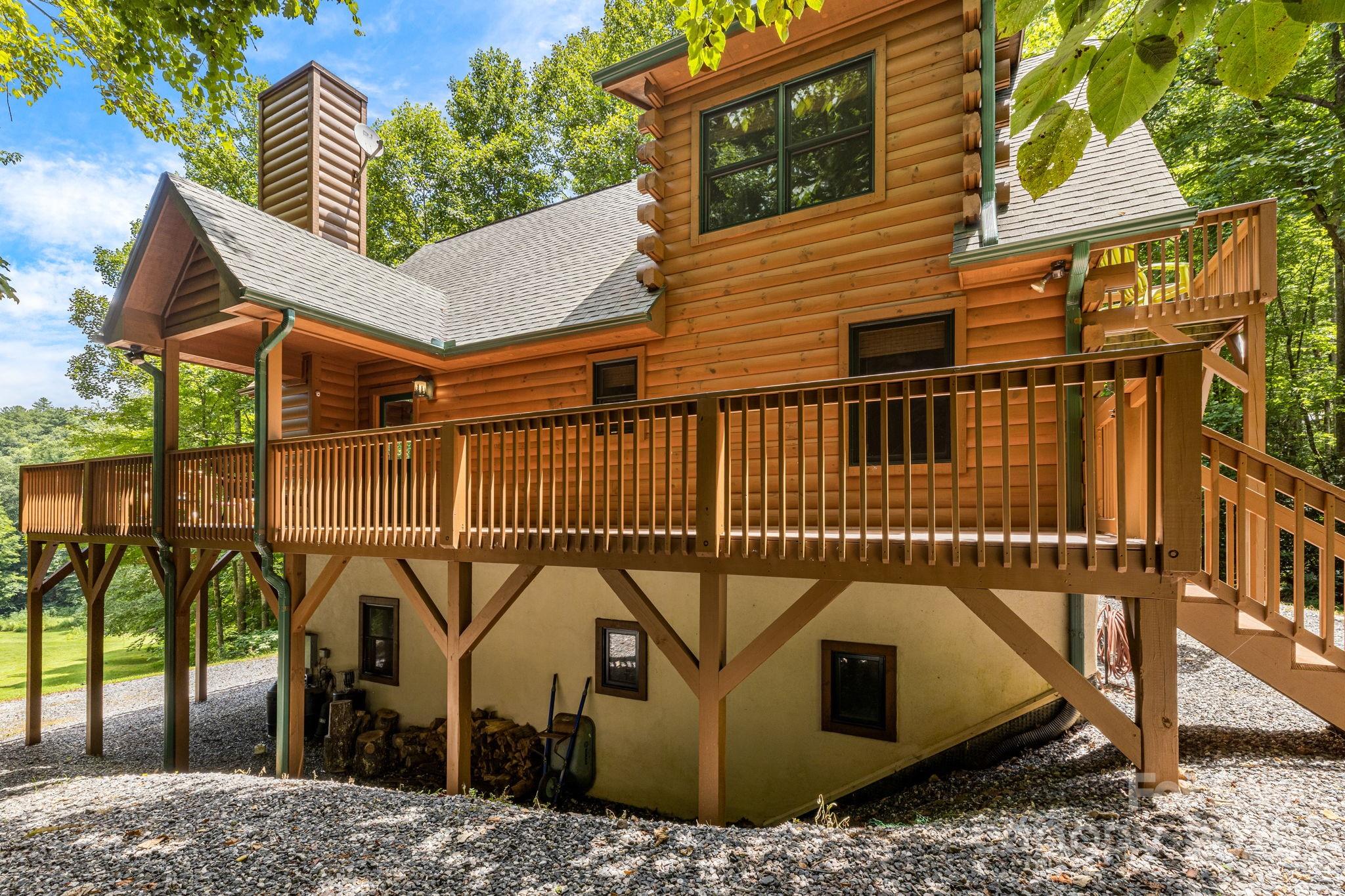 3617 Lonesome Mountain Road Marshall, NC 28753 - Photo 39 of 46 a view of a roof deck with couches and wooden floor