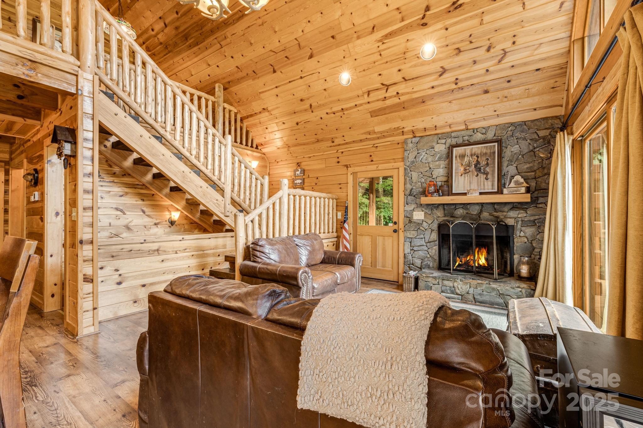 3617 Lonesome Mountain Road Marshall, NC 28753 - Photo 5 of 46 a living room with furniture and a fireplace