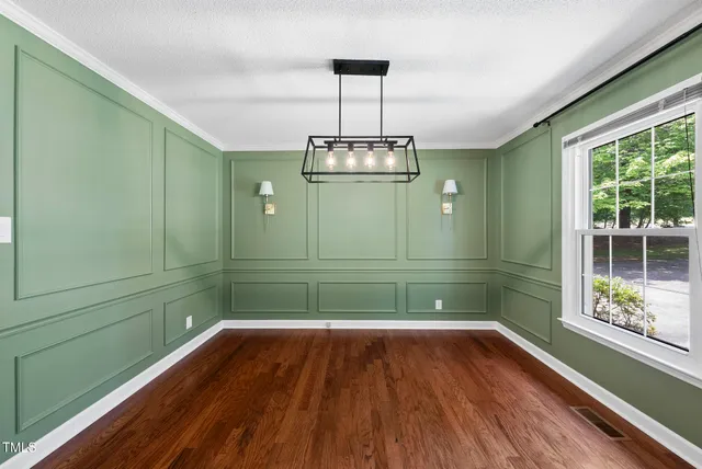 a bathroom with a large mirror and a shower