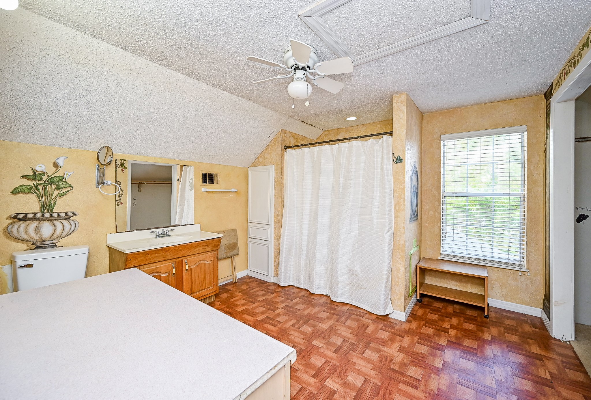 2806 Du Pont Street Pasadena, TX 77503 - Photo 12 of 20 a bedroom with a bed and a chandelier