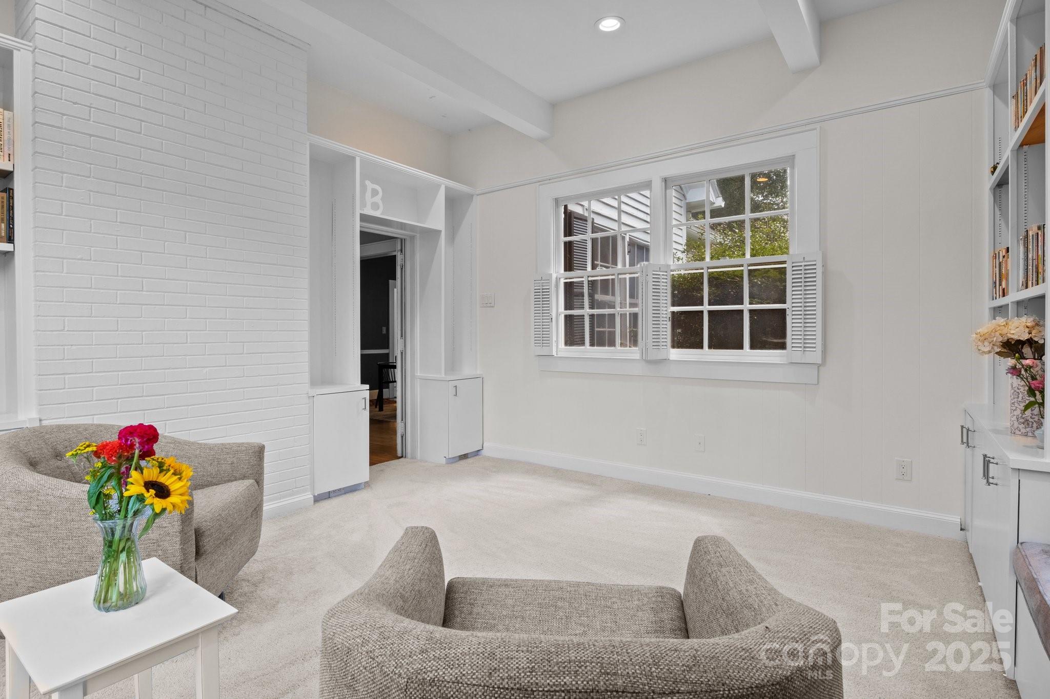 560 Concord Road Davidson, NC 28036 - Photo 13 of 34 a living room with furniture and flower pot