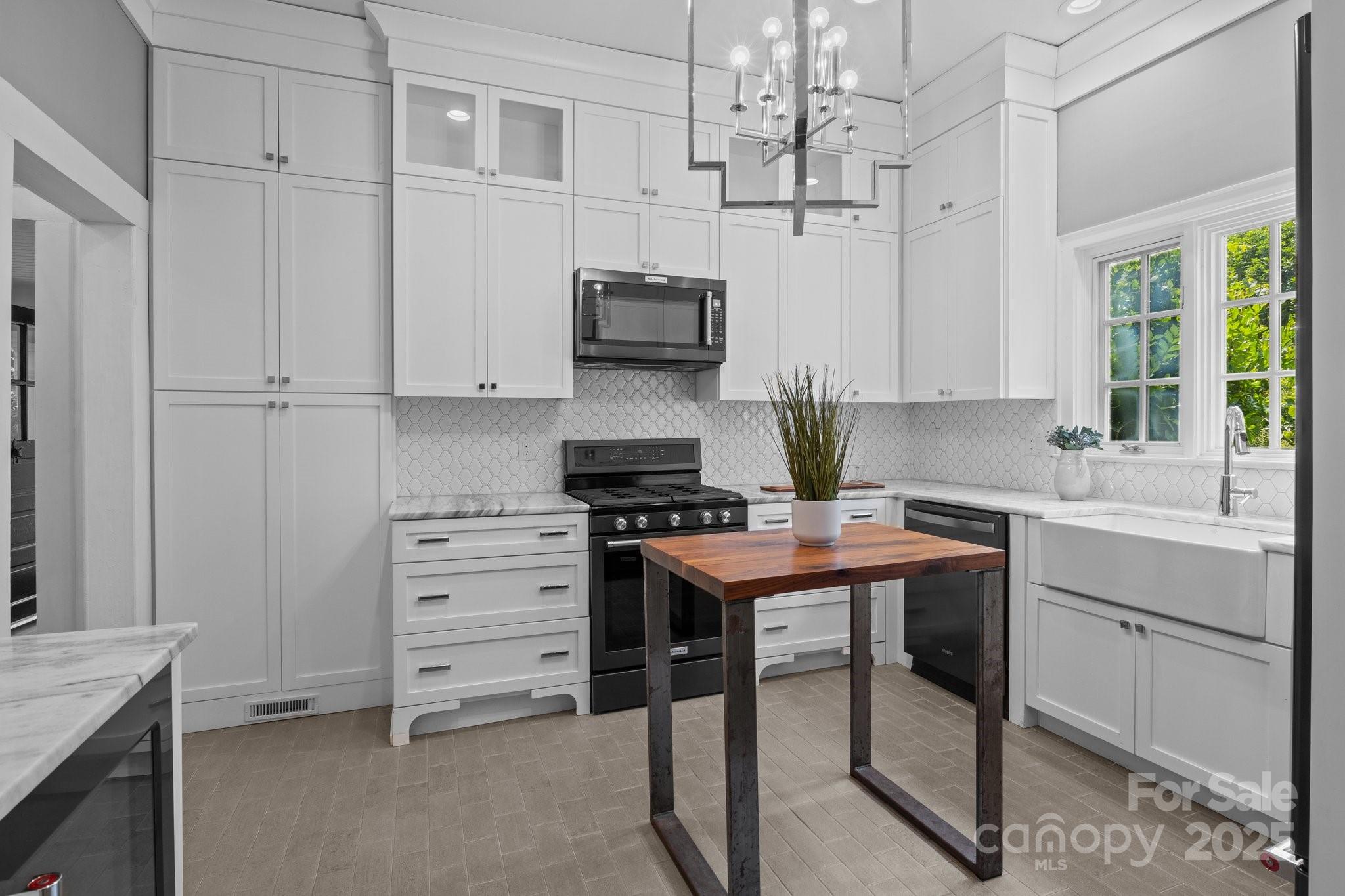 560 Concord Road Davidson, NC 28036 - Photo 16 of 34 a kitchen with cabinets appliances and a window