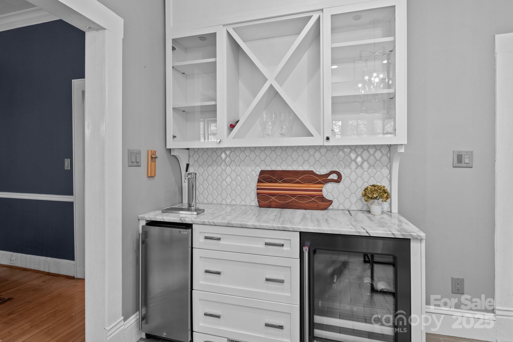 560 Concord Road Davidson, NC 28036 - Photo 19 of 34 a kitchen with white cabinets and a sink
