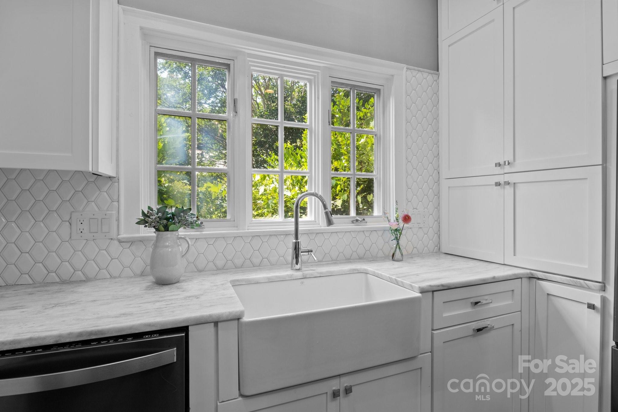560 Concord Road Davidson, NC 28036 - Photo 21 of 34 a kitchen with cabinets appliances and a sink
