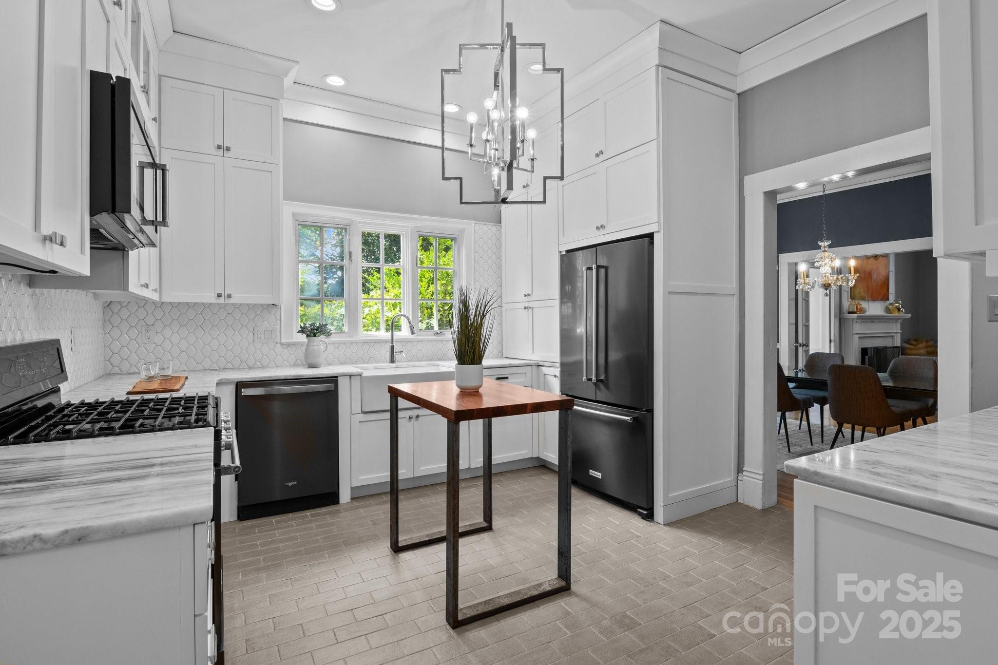 560 Concord Road Davidson, NC 28036 - Photo 23 of 34 a kitchen with stainless steel appliances granite countertop a refrigerator and a stove top oven
