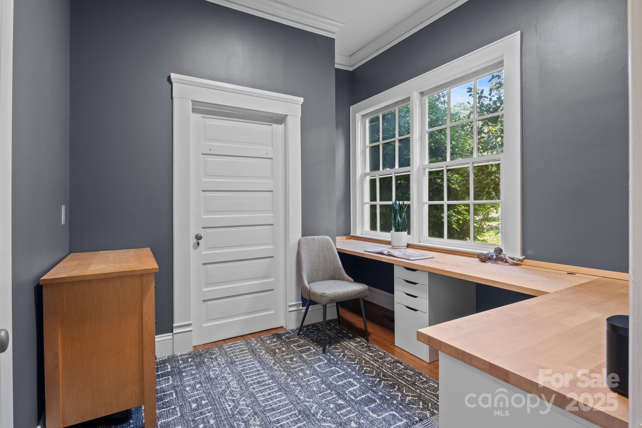 560 Concord Road Davidson, NC 28036 - Photo 27 of 34 a room with a chair and a washer dryer
