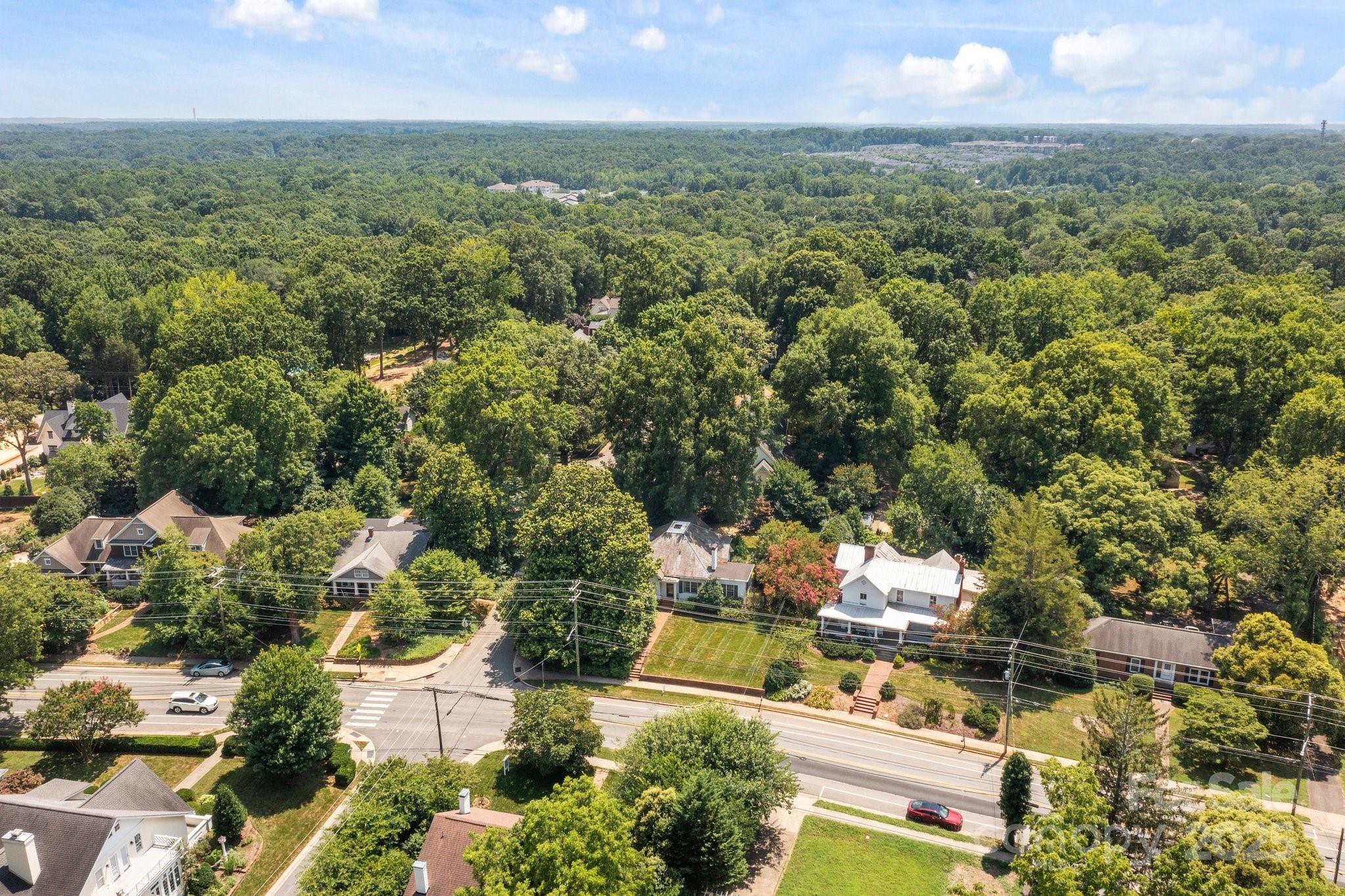 560 Concord Road Davidson, NC 28036 - Photo 34 of 34 an aerial view of residential houses with outdoor space and trees