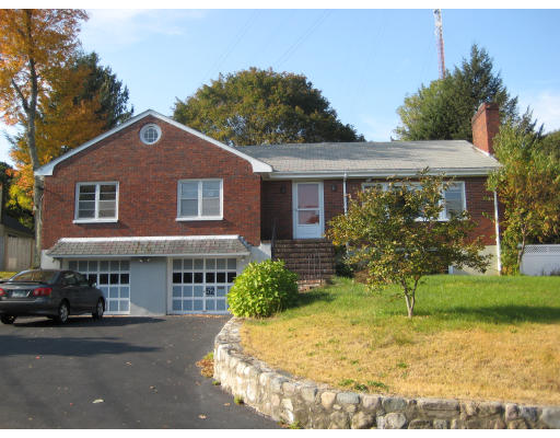 52 St Mary Street Needham, MA 02494 - Photo 1 of 1 a front view of a house with a yard and garage