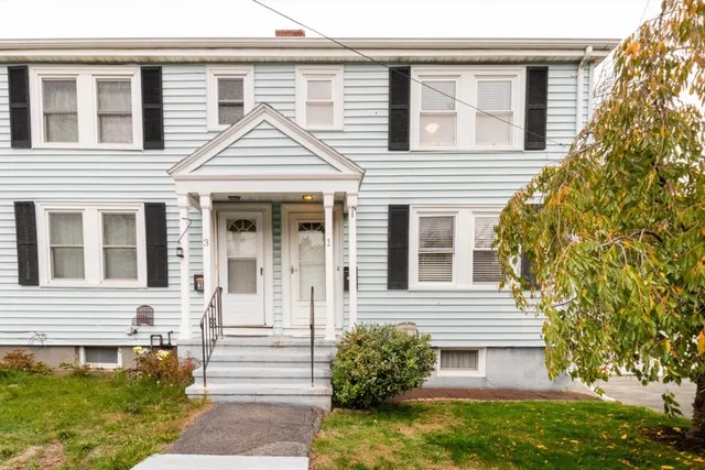front view of a house with a yard