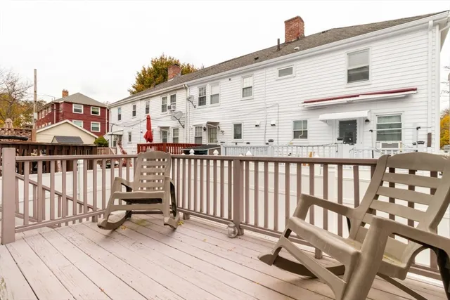 a view of a house with wooden deck