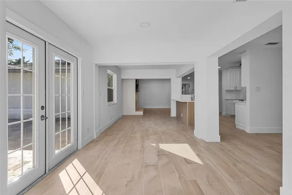 a spacious bedroom with a bed and window