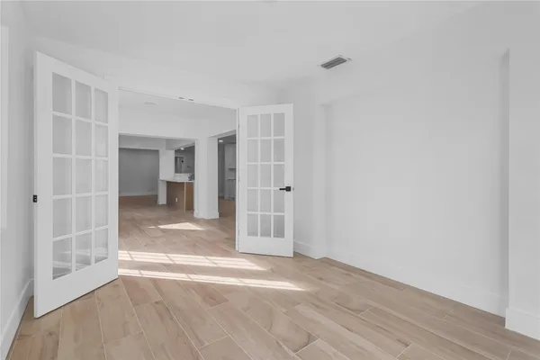 a bathroom with a double vanity sink toilet mirror and shower