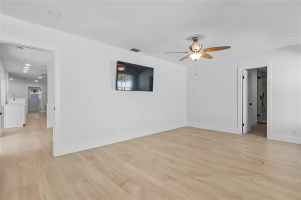 a view of an empty room with a window
