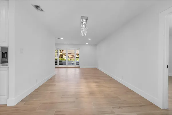 a view of a kitchen with furniture and a flat screen tv