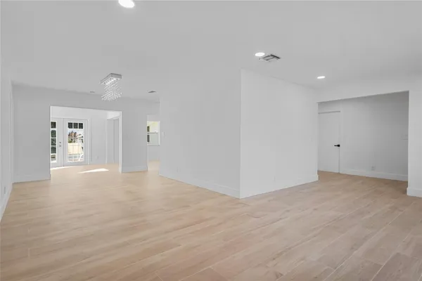 a view of a room with rack on the wall and a window