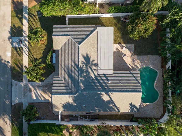 a view of a swimming pool with a house and a outdoor space