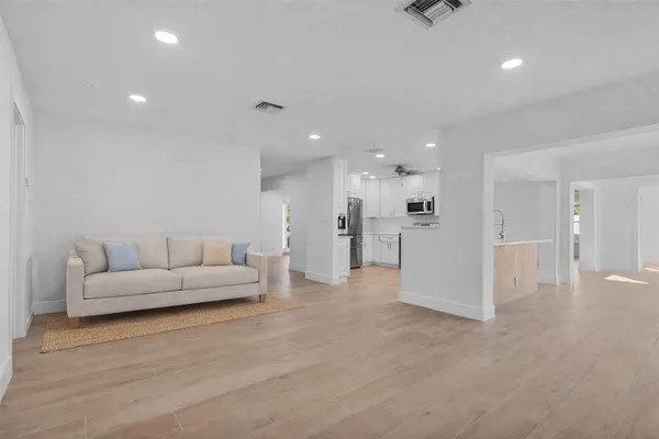 a view of wooden floor and windows in a room