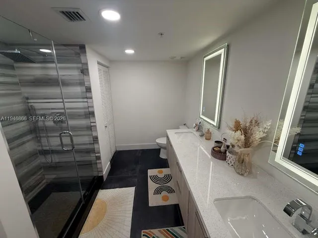a bathroom with a sink and a shower
