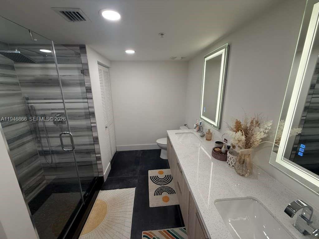 a bathroom with a sink and a shower