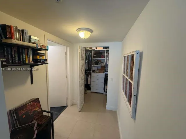 a view of a livingroom with furniture and staircase