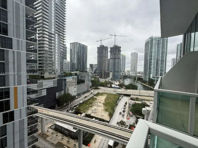 a view of a city from a balcony with city view