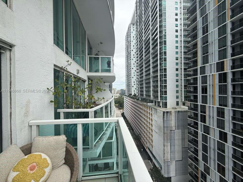 41 Southeast 5th Street, Unit 912 Miami, FL 33131 - Photo 20 of 23 a view of balcony with furniture