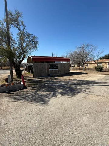 a view of a backyard of a house