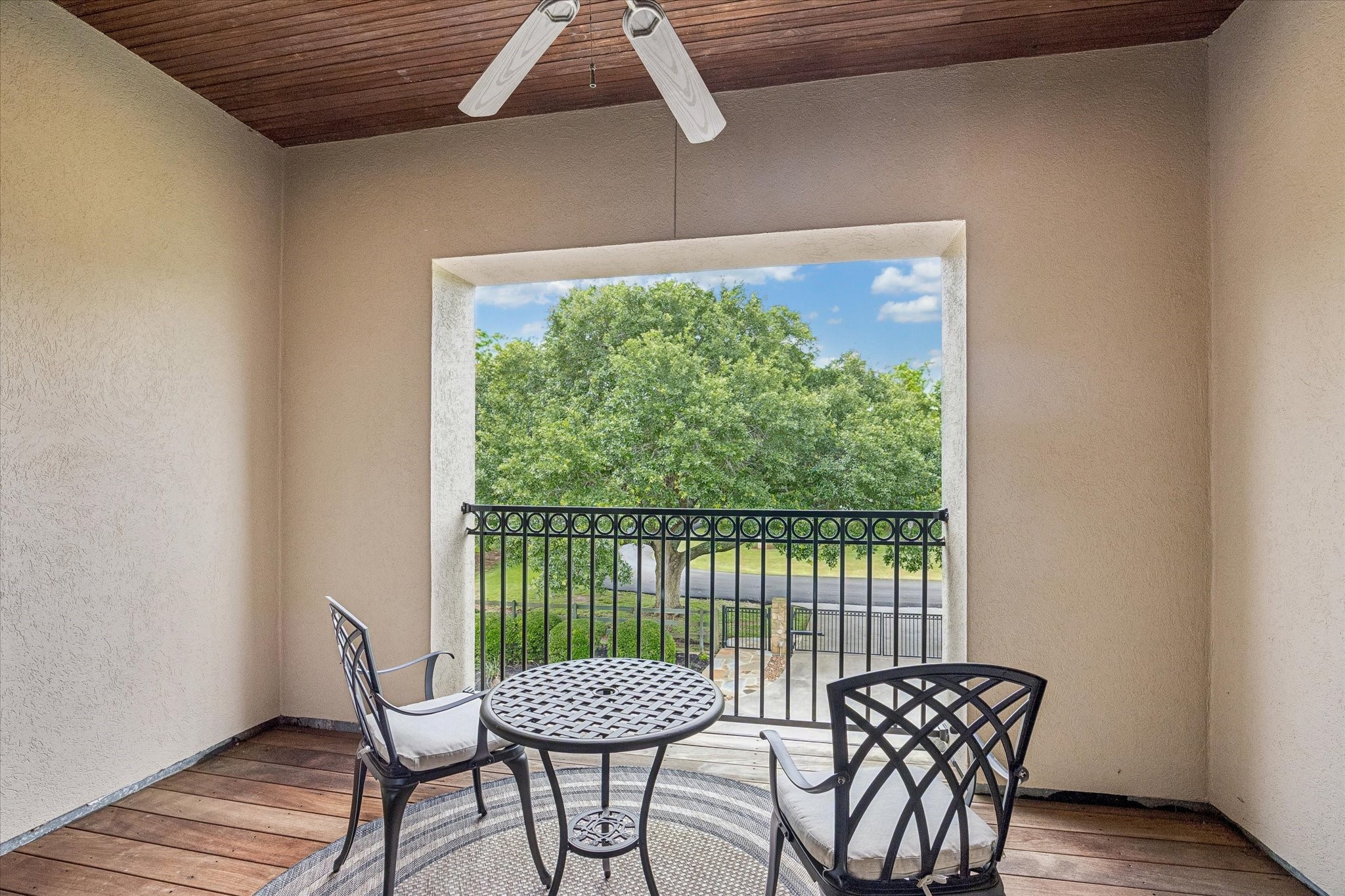 32102 Fulbrook Commons Fulshear, TX 77441 - Photo 33 of 50 Enjoy a quiet morning coffee or unwind in the evening from this covered balcony overlooking the beautifully maintained grounds.
