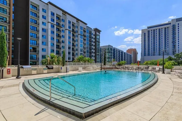 a view of swimming pool with outdoor seating