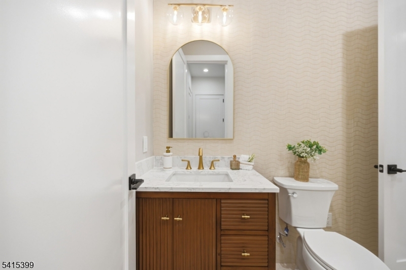 41 Orchard Road Florham Park, NJ 07932 - Photo 13 of 34 a bathroom with a sink vanity and a toilet