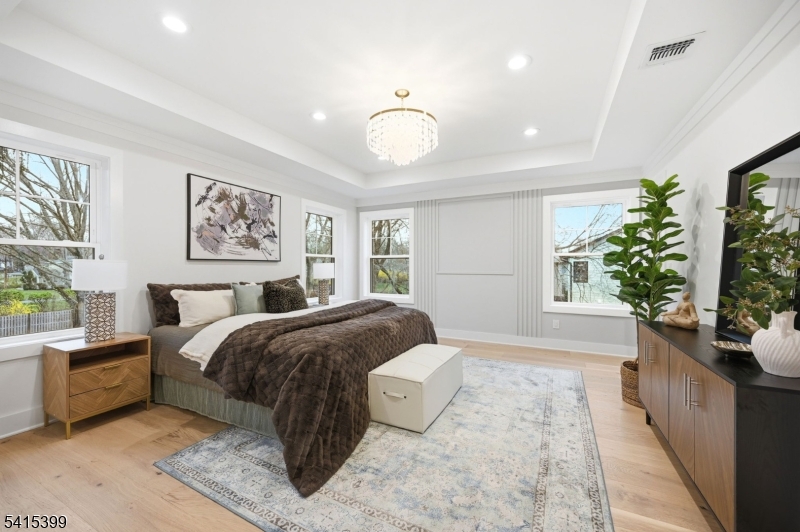41 Orchard Road Florham Park, NJ 07932 - Photo 18 of 34 a spacious bedroom with a bed and a window