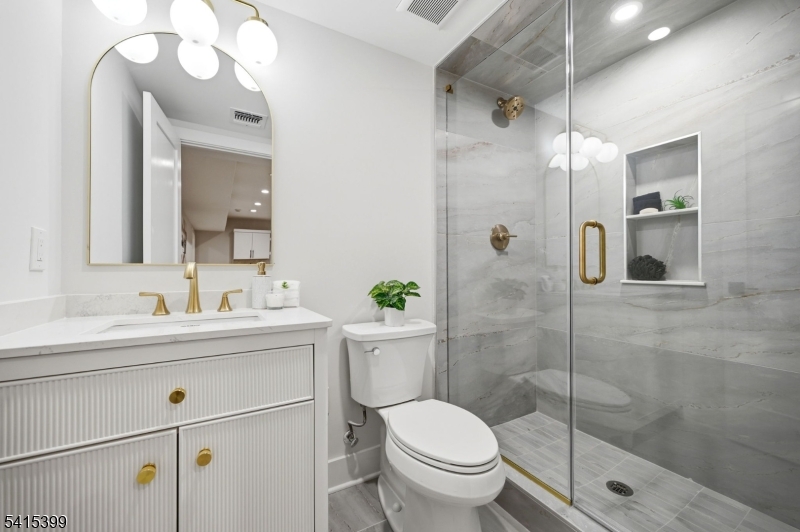 41 Orchard Road Florham Park, NJ 07932 - Photo 25 of 34 a bathroom with a sink a toilet and shower